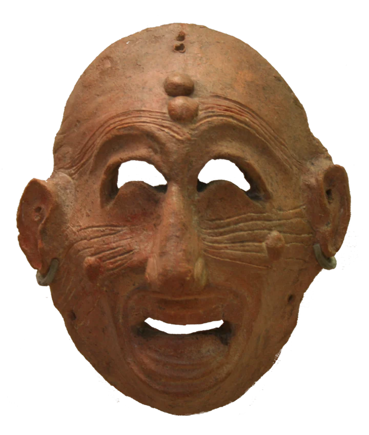 Carthaginian terracotta mask, entering the composition from the sheet edge.